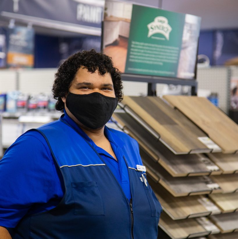 Store Associate standing with mask on